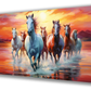 Canvas painting of seven running horses in white and brown with a yellow and orange sky background. Perfect for living room decor, this vibrant wall art also functions as a vastu painting.